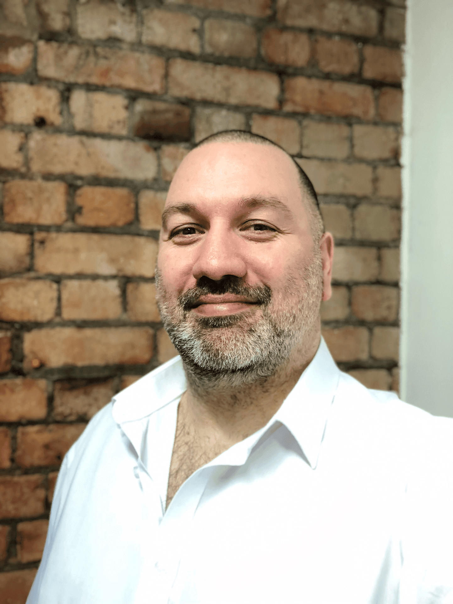 A profile photograph of Jaymie Thomas, head of tech at Wildcard Technology